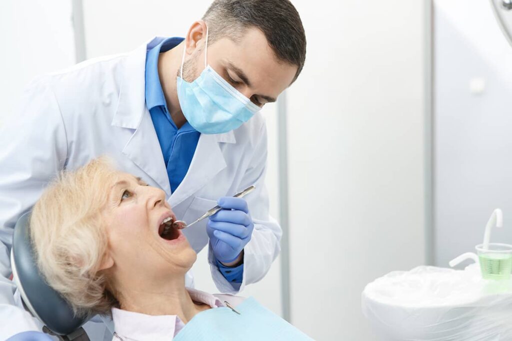 It is important to visit a dentist for checkups, even as you age. They can help spot any potential problems and ensure that your teeth and gums stay healthy