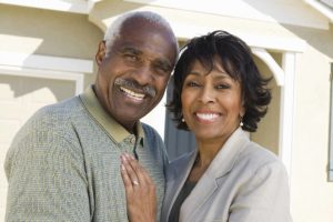 A couple with beautiful smiles after a dental treatment.