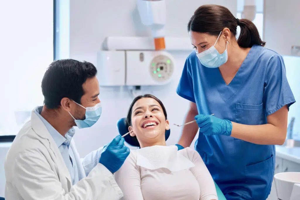 Dental patient with two dentists, each one with a different degree name.